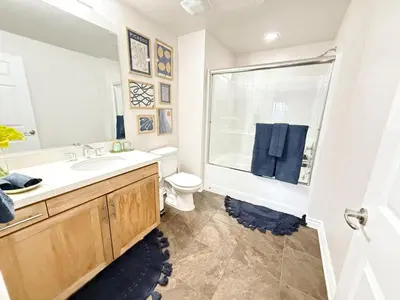 a bathroom with a sink and a toilet and a mirror at 3BR Retreat in Prime Valley Location 109 in Encino