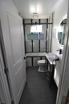 a small bathroom with a toilet and a sink at Urban Oasis in Los Angeles