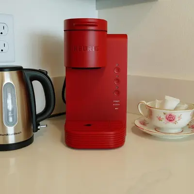 a red appliance sitting on a counter next to a cup at Ocean Haven Beachfront Getaway by Redondo Pier in Redondo Beach