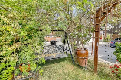 a swing in a garden with a tree at Fullerton Home Base Easy Access to Dtwn and CSUF! in Fullerton