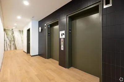 a hallway with a row of elevators in a building at Westwood Penthouse 3 Bedroom 2 Bath w Gym, Balcony, Parking in Los Angeles