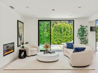 a living room with two chairs and a coffee table at Casa Leona in Los Angeles