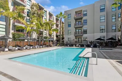 an image of a swimming pool at a apartment complex at Spectacular LOFT in Heart of LA with GYM, Pool, parking in Los Angeles