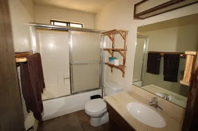 a bathroom with a sink and a toilet and a shower at Gold Rush in Big Bear Lake