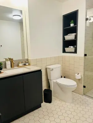 a bathroom with a toilet and a sink at Chic Hollywood Dream Large Studio in Los Angeles