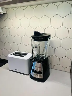 a blender sitting on a counter next to a toaster at Chic Hollywood Dream Large Studio in Los Angeles