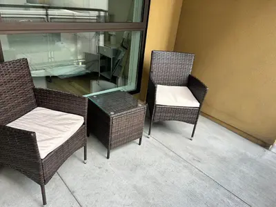 three chairs and a glass table in a room at Chic Hollywood Dream Large Studio in Los Angeles