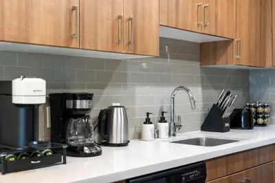 a kitchen counter with a sink and a coffee maker at Moonstone Quiet Retreat Marina Side Garden view in Los Angeles
