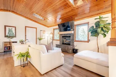 a living room with white furniture and wooden ceilings at Sleeps 10 Cozy Modern Cabin 4 bedroom 3 bath 2400 sq ft 3 story Updated Quiet cabin in Crestline