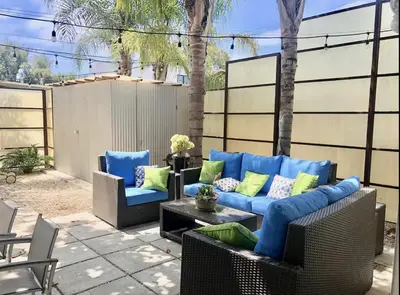 a patio with two couches and a table at Amenity-Rich Abbot Kinney Venice Oasis! in Los Angeles