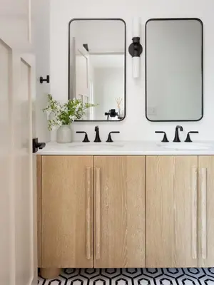 a bathroom with a sink and a mirror at Modern and Charming Luxe Home in Los Angeles in Altadena