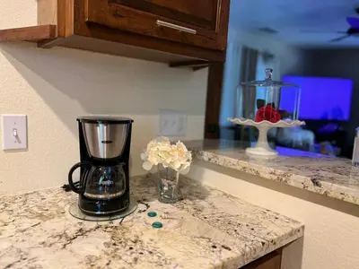 a kitchen counter with a blender on a counter top at Cozy Cabin in Crestline