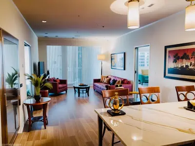 a living room with a couch and a table at Venice Beach Getaway Steps from the Ocean Marina and Boardwalk in Los Angeles