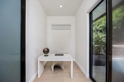 a white desk in a room with a window at Amara by Stay Awhile Villas in Los Angeles