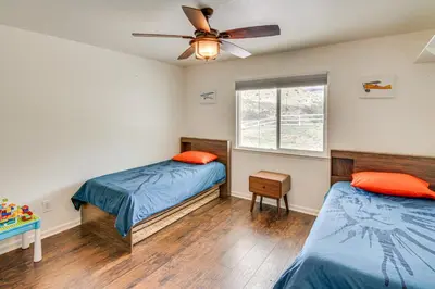 a bedroom with two beds and a ceiling fan at Patio, Fire Pit and Hillside Views Agua Dulce Home in Leona Valley
