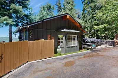 a small building with a fence in front of it at Lakeview Lookout in Skyforest