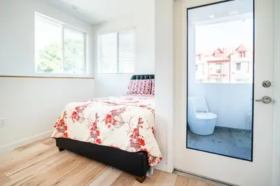 a bedroom with a bed and a window at Modern 2 Bedroom 3 Level Loft by Hollywood Close to Downtown LA Free Gated Parking Full Kitchen in Los Angeles