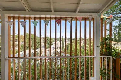 a screened in porch with a gate with a view at Silver Lake Cozy Getaway in Los Angeles