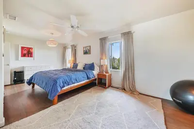 a bedroom with a bed and a ceiling fan at Silver Lake Cozy Getaway in Los Angeles
