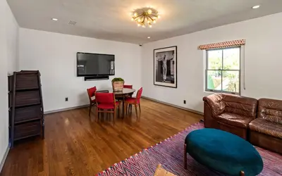 a living room with a couch and a table at Howard Hughes Estate in Los Angeles