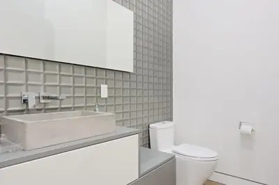 a bathroom with a sink and a toilet at The Artezen Villa by Stay Awhile Villas in Los Angeles