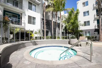 a swimming pool in the courtyard of a building at Blueground Playa Vista pool nr Ballona Creek LAX-1376 in Los Angeles