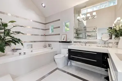 a bathroom with a tub and a toilet and a sink at Hollywood Hills Luxury Retreat in Los Angeles