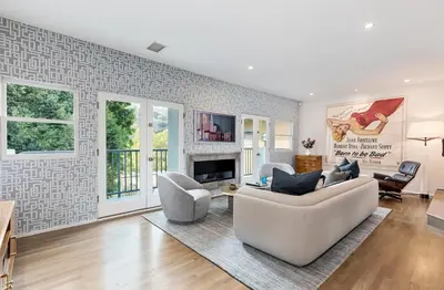 a living room with a couch and chairs and a fireplace at Hollywood Hills Luxury Retreat in Los Angeles