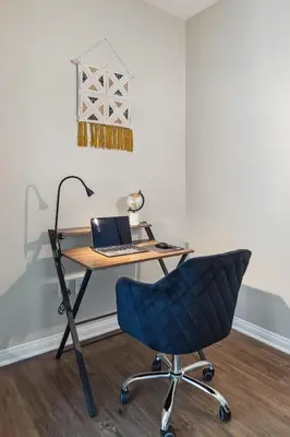 a desk with a laptop and a blue chair at Modern 1bd apt in Marina del Rey w Free Parking in Los Angeles