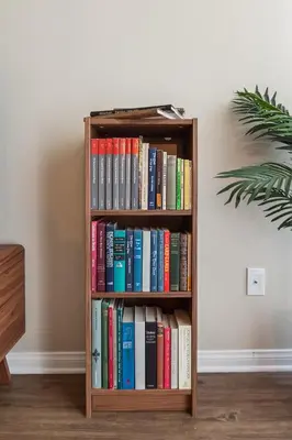 a book shelf filled with books next to a wall at Modern 1bd apt in Marina del Rey w Free Parking in Los Angeles