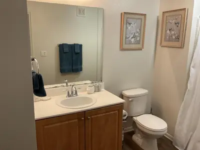 a bathroom with a sink and a toilet and a mirror at Luxe Stay Marina Del Rey in Los Angeles