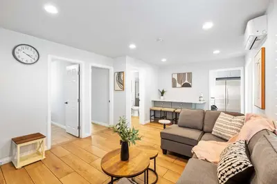a living room with a couch and a table at #Marbella lane - Serene Haven Retreat 3BR in Ontario