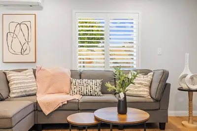 a living room with a couch and a table at #Marbella lane - Serene Haven Retreat 3BR in Ontario