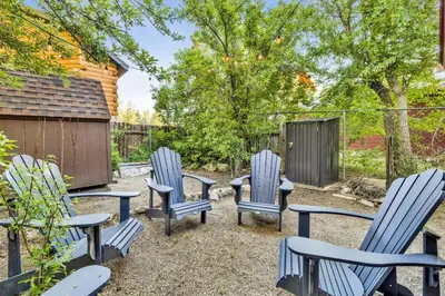 three blue chairs and a table in a yard at Orchard Family Cabin Near Historic Big Bear Village Walk to Marina in Big Bear Lake