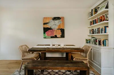 a dining room with a wooden table and chairs at Venice 2BR and Guest Studio with Tub & Garden in Los Angeles