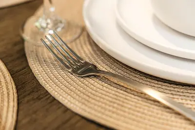 a fork sitting on a plate on a table at Palm & Vine MODERN COZY LOFT in HOLLYWOOD, FREE Parking in Los Angeles