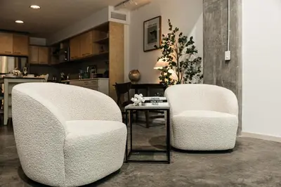 two chairs and a table in a living room at Palm & Vine MODERN COZY LOFT in HOLLYWOOD, FREE Parking in Los Angeles