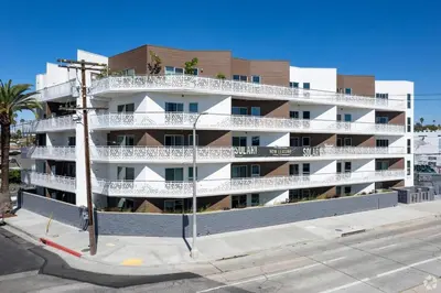 an apartment building with white balconies on a street at Silver Lake 1 Bedroom Condo Suite with Balcony and Parking in Los Angeles