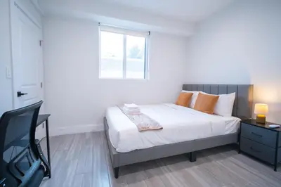 a bedroom with a bed and a window at Modern 2BR2BA Home Near USC Walk to Campus in Los Angeles