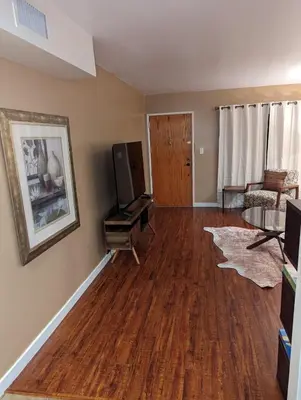 a living room with a hard wood floor at STADIUM LUXURY - CONDO for 4 STEPS AWAY FROM SOFI in Inglewood