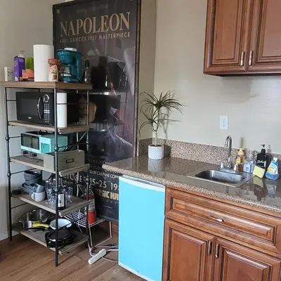 a kitchen with a sink and a counter top at BH Adj, studio spacious BH in Los Angeles