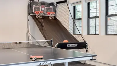 a ping pong court with a basketball hoop at Luxury Retreat 5mins to the Lake Game Room Fire Pit Howlite by AvantStay in Lake Arrowhead
