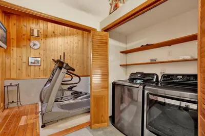a kitchen with a stove and a washer and dryer at Big Bear 7th Heaven #714 in Fawnskin