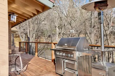 a barbecue on a deck with a grill at Big Bear 7th Heaven #714 in Fawnskin