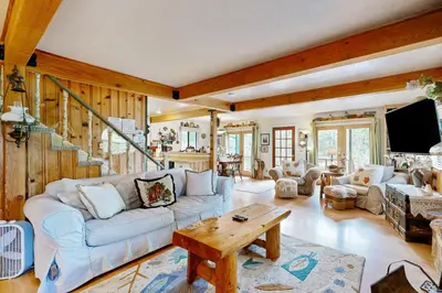 a living room with a couch and a table at Rooster's Den #710 in Big Bear Lake