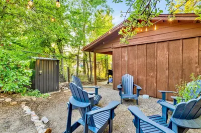 a group of blue chairs sitting outside of a building at Orchard Family Cabin #2560 in Big Bear Lake