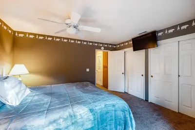 a bedroom with a bed and a ceiling fan at Rosie's Hideaway #331 in Big Bear Lake