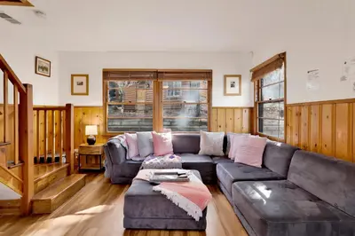 a living room with a couch and a table at Quiet Cabin #564 in Big Bear Lake