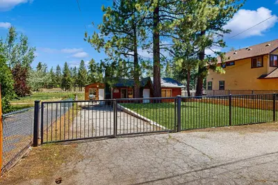 a metal fence in front of a house at Meadow-Front Metcalf Bay Gem #542 in Big Bear Lake