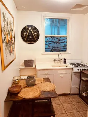 a kitchen with a table and a sink and a window at Cozy Studio Studio City Unit 6 in Los Angeles